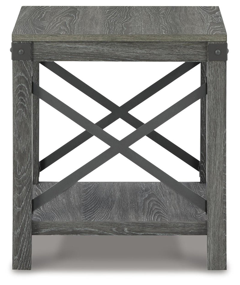 Ashley Furniture Freedan End Table with a sleek wooden surface and modern design, shown in a cozy living room setting.