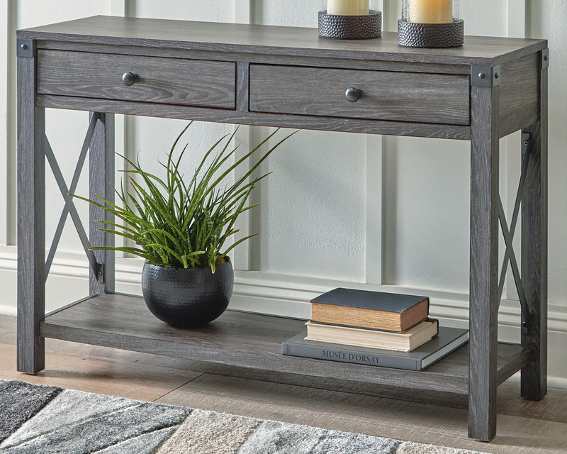 Ashley Furniture Freedan sofa console table with sleek wooden finish, featuring a modern design and spacious tabletop.