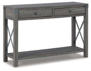 Ashley Furniture Freedan sofa table with a sleek wooden finish, shown from an angled side view.