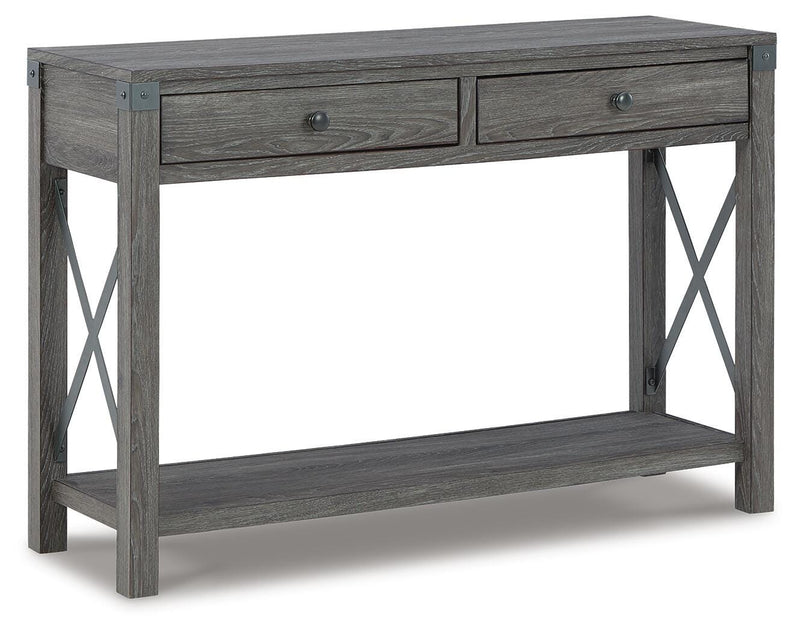 Ashley Furniture Freedan sofa table with a sleek wooden finish, shown from an angled side view.