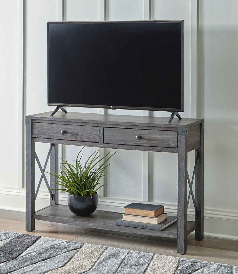 Ashley Furniture Freedan sofa console table with a sleek wooden surface and modern design, shown in a close-up view.
