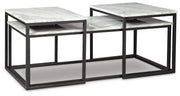 Set of three Ashley Furniture Donnesta tables with angled nesting design, shown from an angled side view.