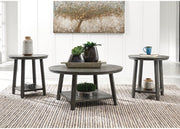Set of three Ashley Furniture Caitbrook tables with wooden tops and tapered legs, arranged together in a modern living room setting.