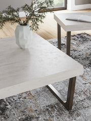 Set of two Ashley Furniture Westenfort Tables, 3-pack, featuring modern wooden tops and sturdy metal legs.