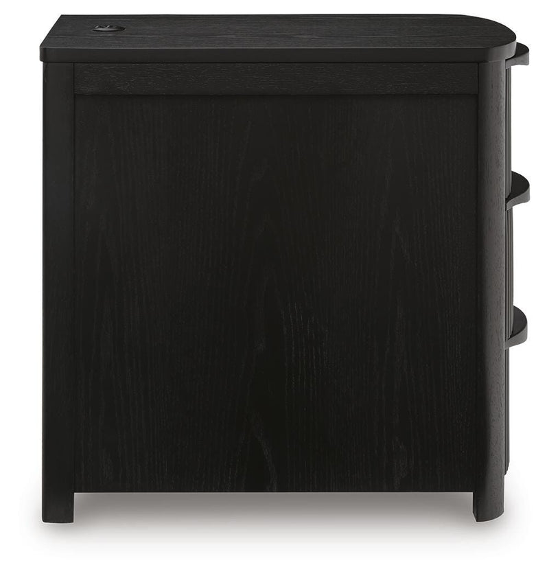 Ashley Furniture Camdill chairside end table with a sleek wooden surface and modern design, perfect for living room use.