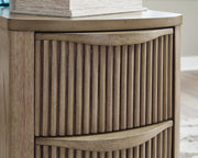 Ashley Furniture Camdill chairside end table with a wooden finish and compact design, ideal for living room or bedroom use.