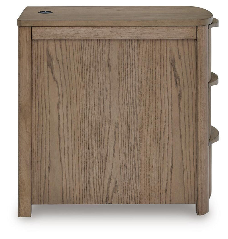 Ashley Furniture Camdill chairside end table with a dark wood finish and a single drawer, designed for living room use.