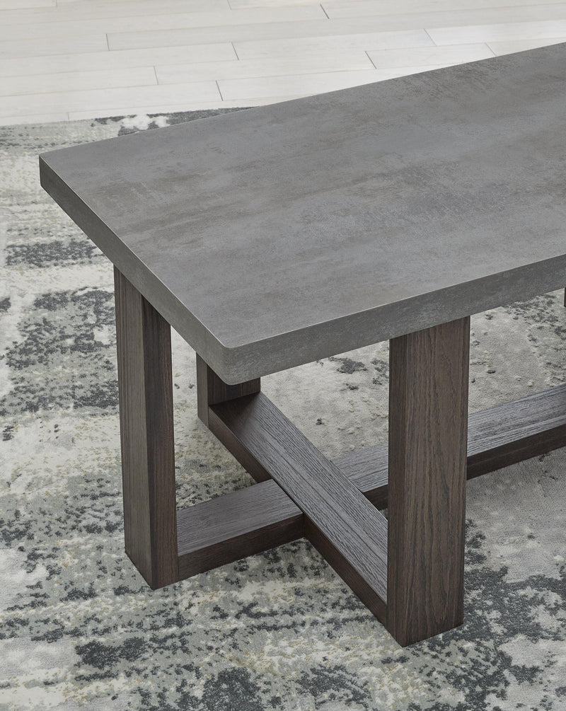 Set of three Ashley Furniture Dynnford tables with wood finish and sleek design, shown in a close-up detail shot.