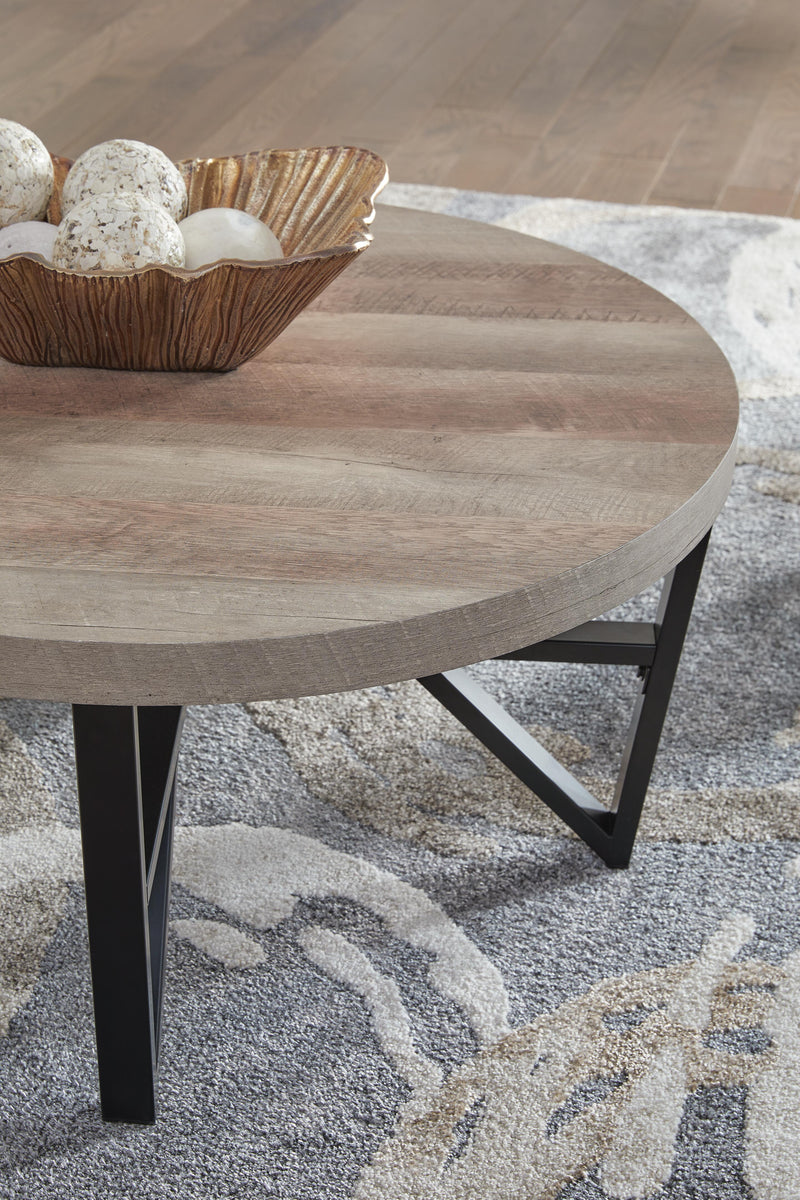 Set of three Deanlee tables by Ashley Furniture with wooden tops and metal legs, arranged together for versatile living room decor.