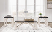 Set of three Ashley Furniture Dorrinson tables in natural wood finish, showcasing modern living room decor.