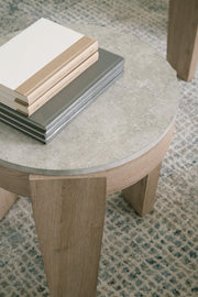 Set of three Ashley Furniture Guystone tables with modern design and textured stone finishes, perfect for living room decor.