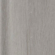 Set of three Garnilly tables by Ashley Furniture, featuring sleek bases and finishes, arranged together on a neutral background.
