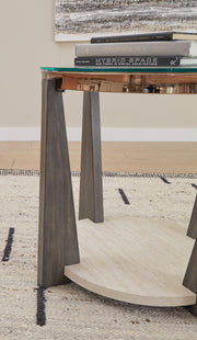 Detail view of Ashley Furniture Frazwa occasional table set showing three modern tables with wood finishes and sleek designs.