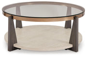 Ashley Furniture Frazwa occasional table set with round wooden tops and sleek metal legs, shown in a modern living room setting