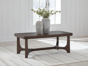 Ashley Furniture Korestone Occasional Table Set with modern living room tables, featuring sleek surfaces and sturdy wooden legs.