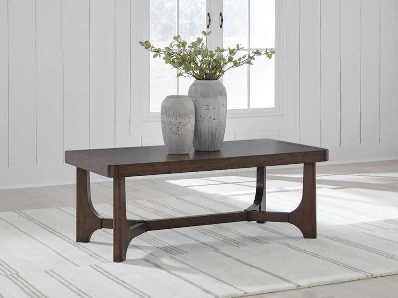 Ashley Furniture Korestone Occasional Table Set with modern living room tables, featuring sleek surfaces and sturdy wooden legs.