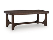 Ashley Furniture Korestone living room table set with two modern beige tables featuring sleek wooden legs and smooth tabletops.