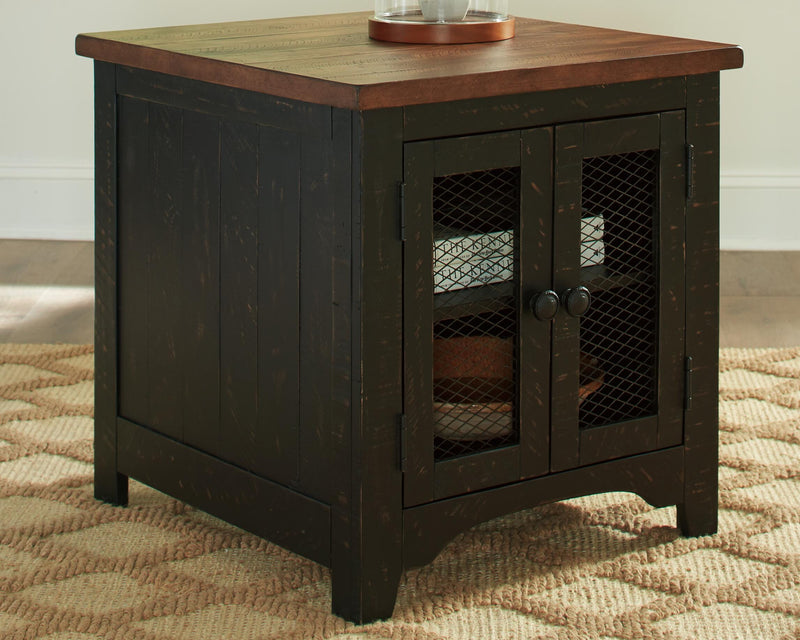 Ashley Furniture Valebeck Table Set with a wooden dining table and matching chairs, featuring a modern design and warm finish.