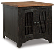 Ashley Furniture Valebeck Occasional Table Set showing three modern tables with wooden tops and metal legs in a living room setting.