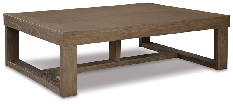 Ashley Furniture Cariton coffee cocktail table with a sleek wood finish, angled design, and modern style.