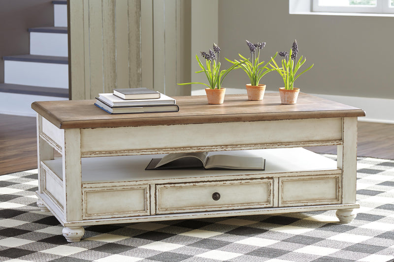 Ashley Furniture Realyn Occasional Table Set featuring a modern design with three nested tables in a dark finish.
