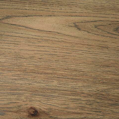 Ashley Furniture Flangren End Table showing a sleek wooden surface with tapered legs and a contemporary design.
