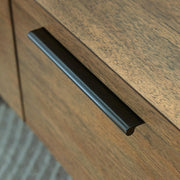 Ashley Furniture Montia lift-top coffee table with handle detail, featuring a versatile cocktail table with a lift-top design.