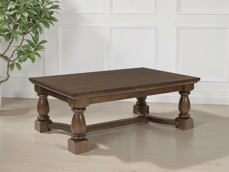 Ashley Furniture Sturlayne coffee table with a sleek, modern cocktail table design featuring a wooden finish and sturdy legs.