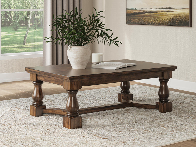 Ashley Furniture Sturlayne coffee table with a sleek wooden top and modern design, perfect for living room or cocktail area.