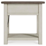 Ashley Furniture Bolanburg chairside end table with a dark wood finish and simple design, shown from a side angle.