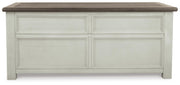 Ashley Furniture Bolanburg lift top coffee table with dark wood finish, featuring a spacious surface and storage compartment.