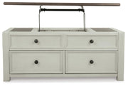 Ashley Furniture Bolanburg coffee table with lift top, showing a wooden cocktail table with a raised lid and storage space.