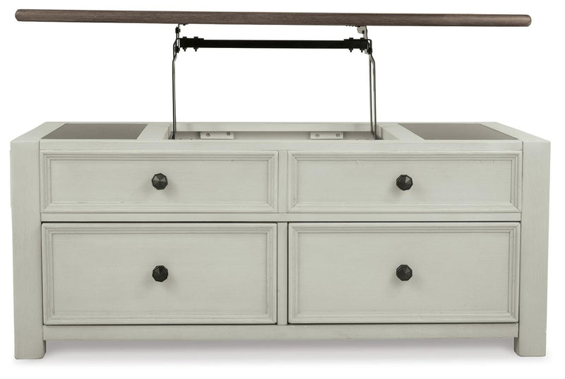 Ashley Furniture Bolanburg coffee table with lift top, showing a wooden cocktail table with a raised lid and storage space.