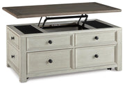 Ashley Furniture Bolanburg coffee table with lift top, showing the open cocktail table with storage and sleek wood finish.