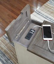 Ashley Furniture Bolanburg occasional table set featuring two modern tables with wooden tops and metal legs.