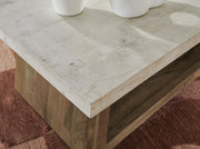 Close-up of the Ashley Furniture Brendalhouse coffee cocktail table top with detailed wood grain finish.