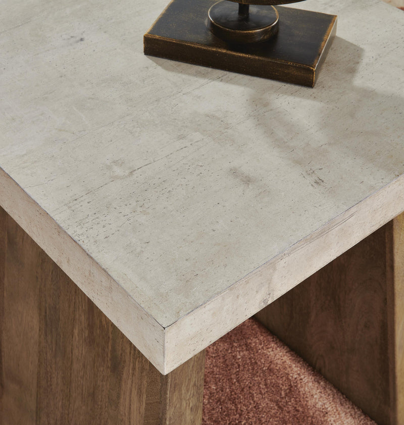 Close-up of the Ashley Furniture Brendalhouse end table top with detailed wood grain and elegant finish.