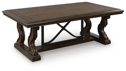 Ashley Furniture Maylee coffee cocktail table with a sleek wooden finish and modern design, shown from an angled side view.