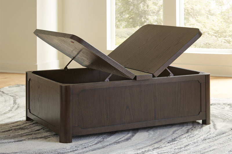 Open view of Ashley Furniture Breckington coffee table with storage, showcasing its sleek design and spacious tabletop.