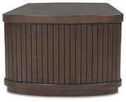 Ashley Furniture Korestone living room occasional table set with two sleek side tables featuring modern wood finish.