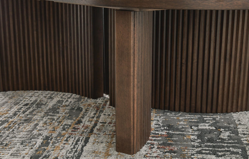 Close-up of Ashley Furniture Korestone cocktail coffee table base with detailed wooden finish and sturdy construction.