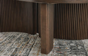 Ashley Furniture Korestone occasional table set with two modern round tables featuring wooden bases and sleek tabletops.