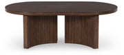 Ashley Furniture Korestone cocktail coffee table with a sleek, modern design and a smooth wooden surface.