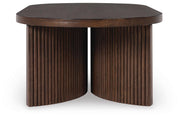 Ashley Furniture Korestone cocktail coffee table with a sleek wooden surface and modern design, shown from a side angle.