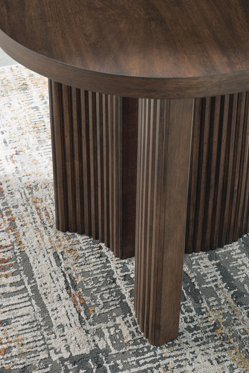 Ashley Furniture Korestone occasional table set with two round tables featuring dark wood bases and smooth tabletops.