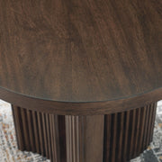 Ashley Furniture Korestone end table with a sleek wooden top and sturdy metal legs, ideal for living room or bedroom decor.