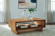 Ashley Furniture Dressonni cocktail coffee table with a sleek wooden finish and modern design, shown in a living room setting.