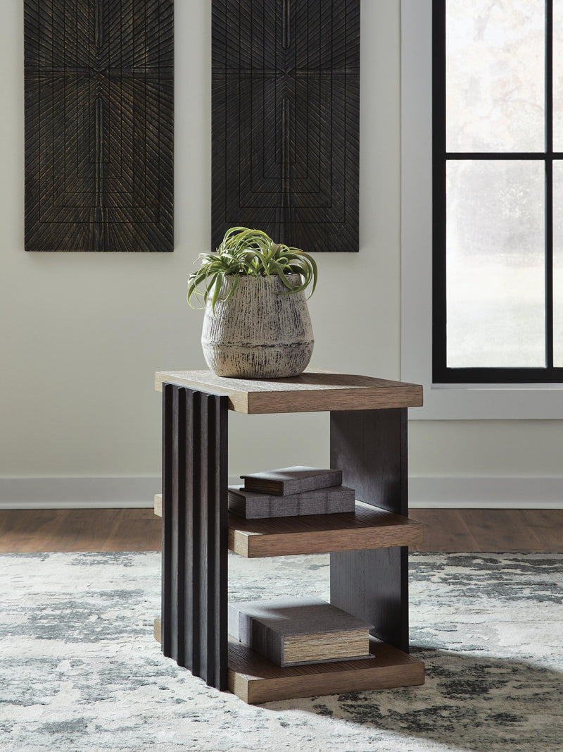 Ashley Furniture Rylandyn end table with a wooden top and metal frame, featuring a modern design and warm wood finish.