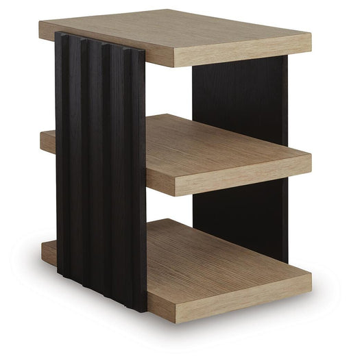 Ashley Furniture Rylandyn End Table with a sleek wooden surface and modern design, shown from an angled side view.