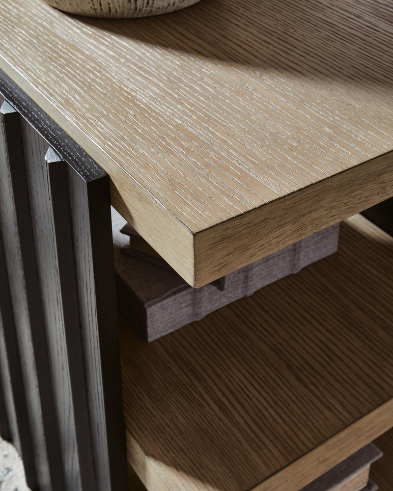 Close-up of the Rylandyn end table by Ashley Furniture, showing its detailed wood finish and stylish tabletop design.